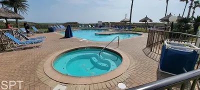 Relaxed poolside setting with a calm coastal vibe—bright water, open space, an easy flow that invites guests to unwind at their own pace. A naturally welcoming spot that feels genuine and unforced without relying on amenities to define the experience