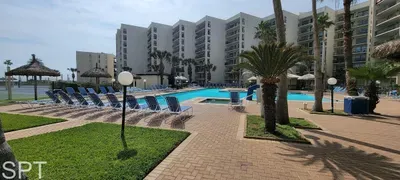 Steady poolside setting with a relaxed coastal feel—open spaces, bright water, and an easy flow that makes unwinding feel natural. A genuine outdoor atmosphere that fits effortlessly into a beachside stay without relying on amenities.