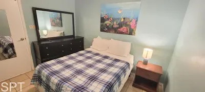 Cozy Bedroom with Underwater Art
Inviting bedroom with soft lighting, clean finishes, and a vibrant ocean‑themed artwork—perfect for a comfortable and relaxing stay.