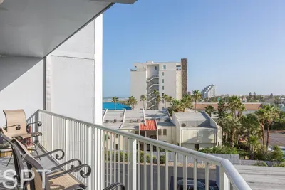 Balcony Seating with Coastal Views
Private balcony with comfortable seating overlooking the coastal town and palm‑lined streets—perfect for morning coffee, sunset lounging, and enjoying the warm seaside breeze.