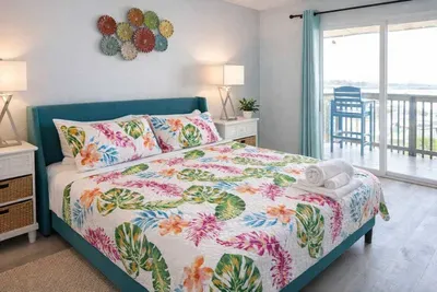 Bright tropical retreat with balcony views, vibrant decor, and natural light—perfect for relaxing getaways near the coast.