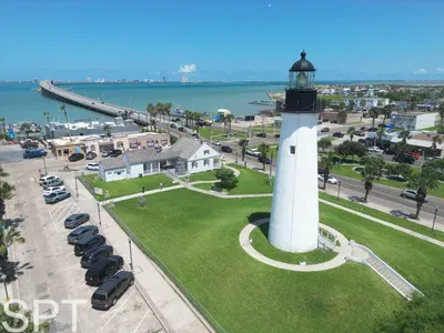 Bright coastal retreat steps from the shoreline, featuring serene water views, a charming lighthouse backdrop, and easy access to nearby dining, beaches, and local attractions—perfect for relaxed getaways and scenic morning walks.