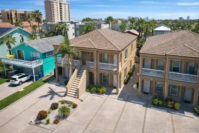 Coastal Townhomes + Vibrant Turquoise Retreat | Walk to Beach | Parking + Balcony Views + Palm Trees