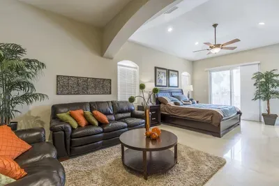 Modern Living Space • Large Leather Sectional, Smart TV & Stylish Built‑Ins • Perfect for Relaxing, Streaming & Gathering After Island Adventures