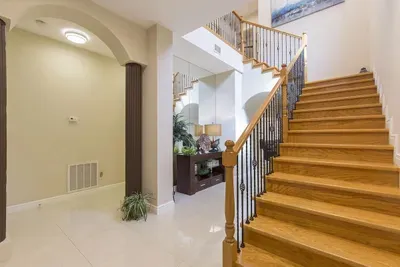 Elegant Entryway • Stylish Wood Staircase, Bright Hallway & Modern Architectural Details • Welcoming First Impression for Your Island Stay