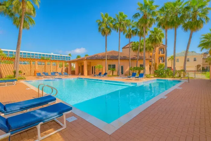 Tropical Poolside Escape with Lounge Seating
Sun-soaked pool retreat with cushioned loungers, palm-lined deck & shaded pavilion. Perfect for relaxing, socializing, soaking up the resort vibe. Steps from stylish accommodations & tropical landscaping.