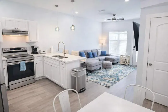 Bright Coastal Retreat | Modern Kitchen + Stylish Living | Steps to Beach & Dining