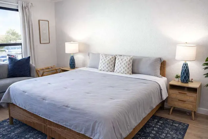 Coastal King Retreat | Bright, Airy Bedroom w/ Beachy Decor, Plush Seating & Dual Nightstands