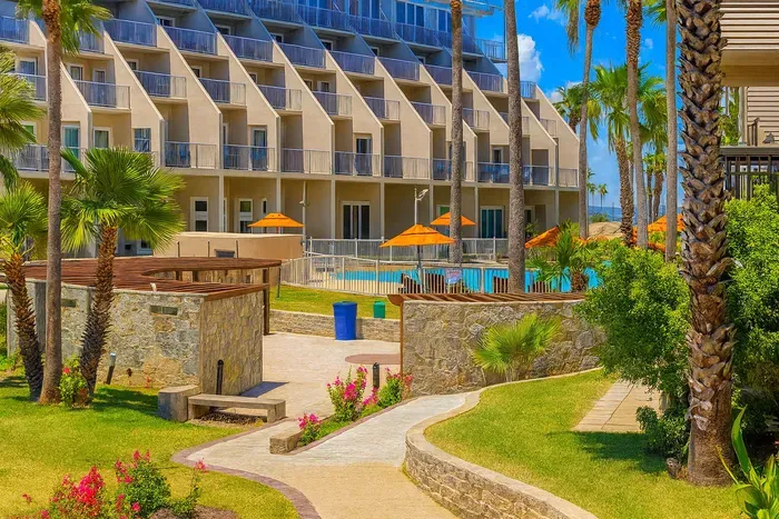 Modern Coastal Resort with Pool, Pergola & Lush Gardens — Steps from the Beach