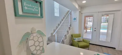 Bright Coastal Entryway with Pool Views — Relaxed Beach Décor, Sunlit Interiors & Easy Indoor‑Outdoor Flow for the Perfect Getaway