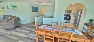 Modern Beach‑House Vibe
Bright, stylish living room featuring comfy seating, beach‑themed décor, and a relaxed island atmosphere—perfect for gathering, unwinding, and enjoying carefree vacation living.