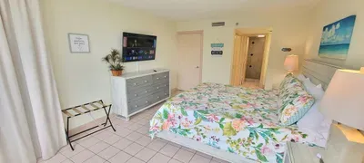 Unwind in this sunlit, coastal‑styled bedroom featuring soft tones, crisp linens, and a relaxing atmosphere. Ideal for restful nights after beach adventures, it offers comfort, charm, and a peaceful retreat within your coastal getaway.