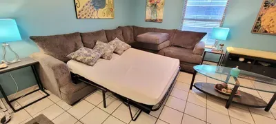 Bright, inviting living space offering a comfy sectional, stylish accents, and easy access to the patio. With a fully equipped kitchen, breakfast bar, and open layout, it’s ideal for relaxing, entertaining, and enjoying a carefree South Padre stay.