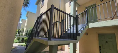 A clean, well‑kept exterior with easy upstairs access, bright natural light, and a neatly landscaped setting. Guests enjoy a welcoming arrival experience with clear pathways, secure entry, and a calm, organized atmosphere throughout their stay.