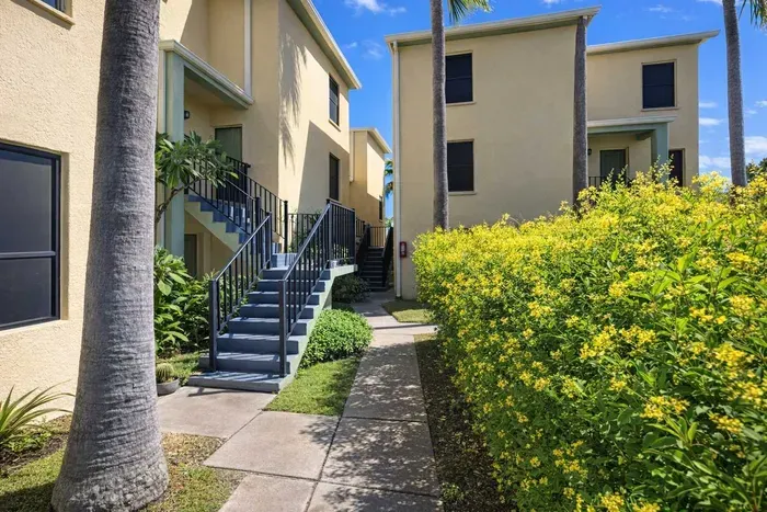 Sunny Palm-Lined Walkway | Bright 2BR Units | Steps to Parking | Lush Landscaping & Private Entry | Ideal for Extended Stays or Weekend Getaways