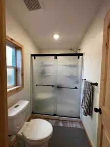 Master Bathroom and Shower. Shower and toilet are private from sink and closet which are private from sleeping area. 