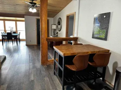 This little table is in the kitchen and seats 4. It is perfect for feeding the kids, snacks, or the bar.