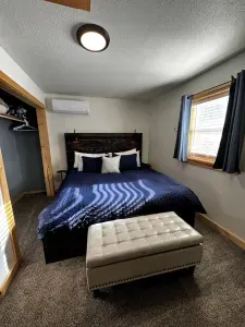 Enjoy a restful stay in our well-appointed bedroom with a comfortable king-size bed.