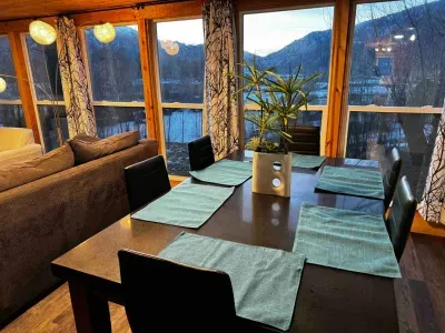 Spacious dining for 6, ideal for family meals with scenic mountain views