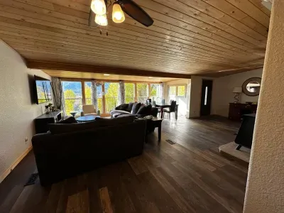 Relax on the comfortable sectional sofa and enjoy the open flow to the dining space. Perfect for unwinding after exploring.