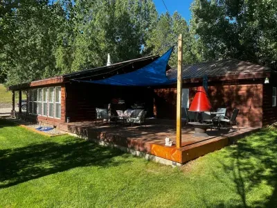 Patio furniture, wood deck, cozy outdoor space.
