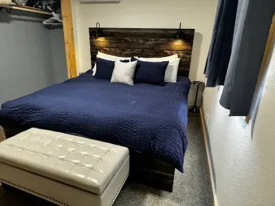 Enjoy a peaceful night's sleep in our well-appointed king bed  with soft linens and ambient lighting.