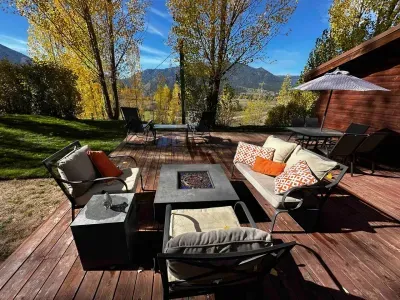 Back yard patio looking west.  Beautiful sunsets, barbecue, lounge furniture, and great SUMMER fire pit.  