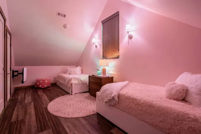 Sleep side by side in style. The tandem twin beds bring cozy comfort and pink perfection