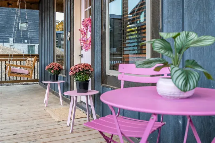 Morning coffee, evening champagne — this pink porch was made for slow sips and soft moments.