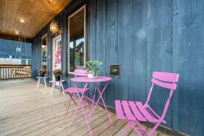 Where cozy meets cute - Pink porch setup that’s just begging for a coffee in hand