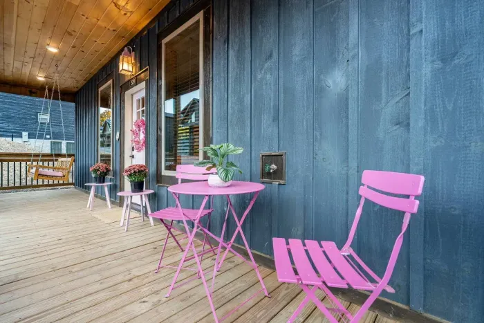 Where cozy meets cute - Pink porch setup that’s just begging for a coffee in hand