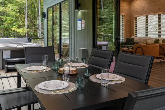 Open the sliding doors and let the outdoors flow in — dinner, laughter, and hot tub nights await.