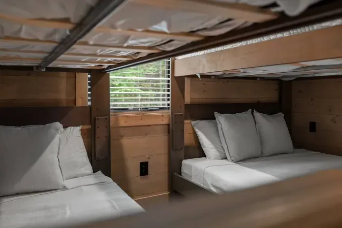 Natural light and warm wood tones create a peaceful nook for rest between all the fun.