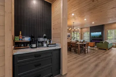 Seamlessly connected — brew your morning coffee while enjoying views of the warm, open living space.