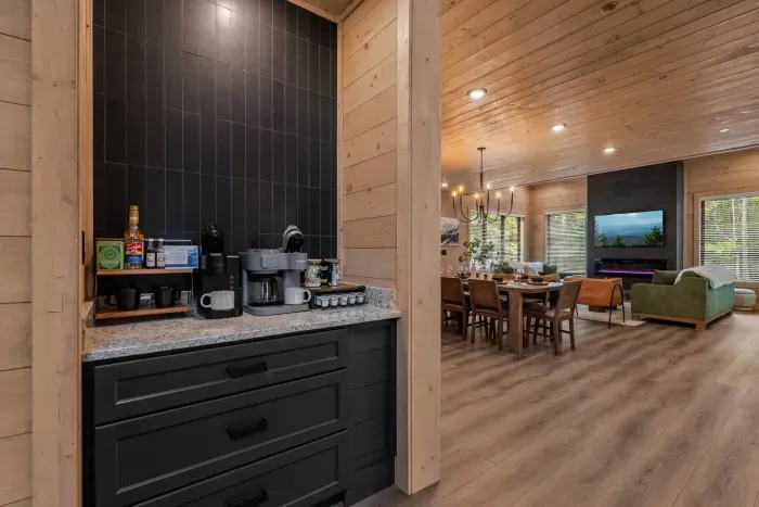 Seamlessly connected — brew your morning coffee while enjoying views of the warm, open living space.