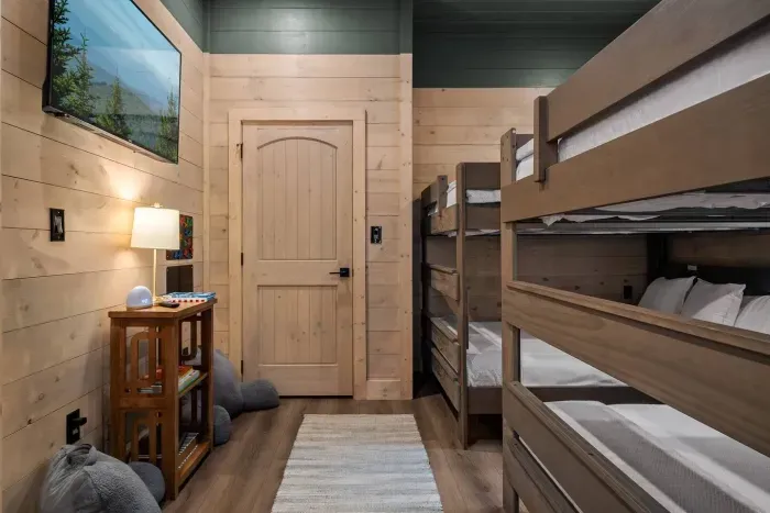 Spacious and inviting, this bunk room offers four queen beds
