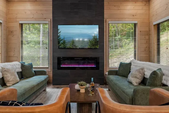 Cozy up by the modern fireplace and enjoy a movie night