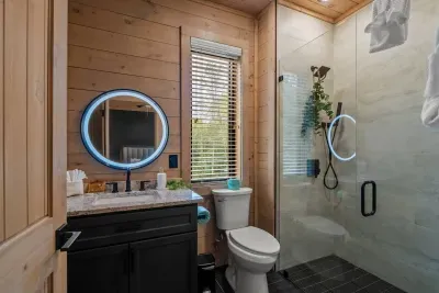 Bathroom has a walk-in closet and starter essentials including a eye mask, shower steamer, and make up wipe.