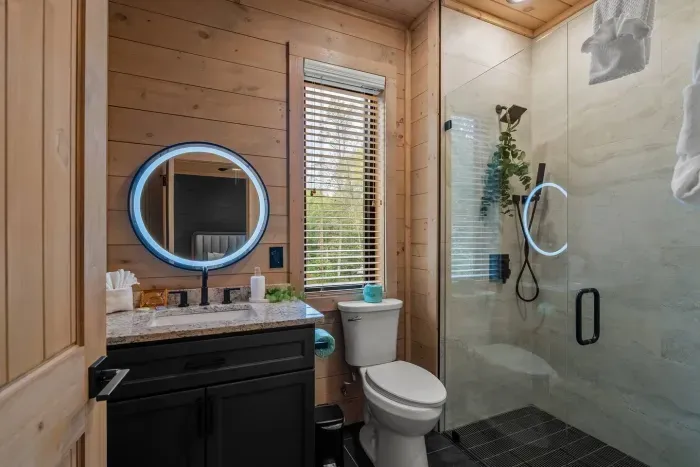 Bathroom has a walk-in closet and starter essentials including a eye mask, shower steamer, and make up wipe.