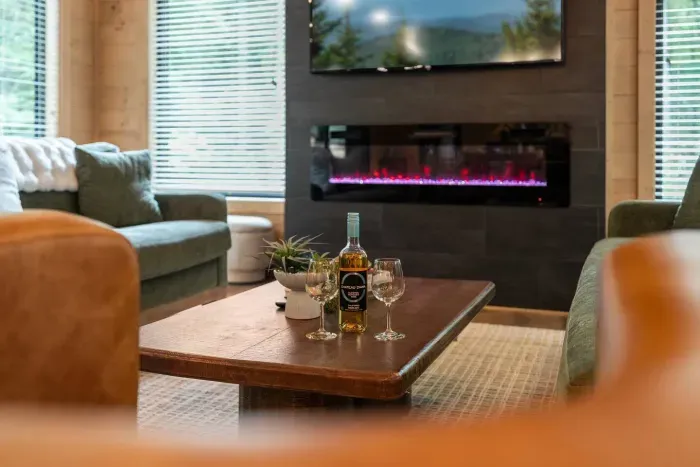 Pour a glass, sink into the sofa, and let the evening unfold by the fire.