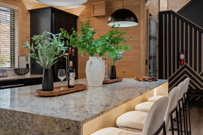 Sleek finishes meet rustic charm in a kitchen built for comfort and conversation.