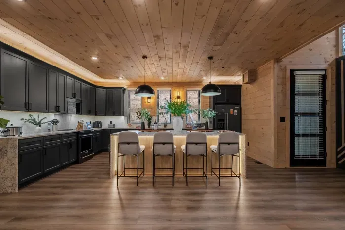 Bright and welcoming kitchen featuring a large island — the perfect spot to gather, cook, and share good company.