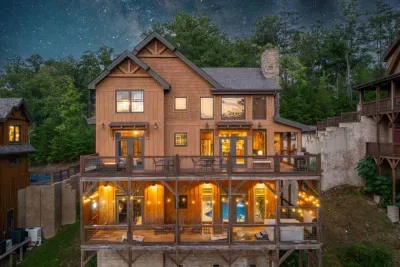 Drone shot / starry night shot of the cabin from the back.