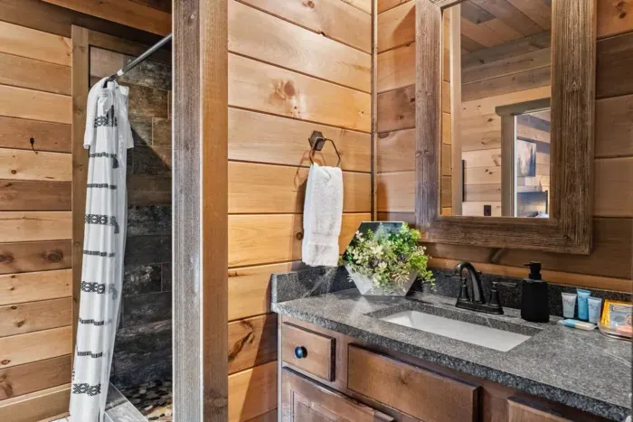 This full bathroom connects directly to Bedroom Two and also opens into the hallway on the main level. Convenient for both private use and easy guest access, it’s a versatile space for the home.