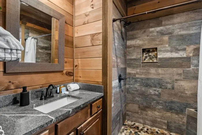 This bathroom includes starter shampoo, conditioner, soap, a hairdryer, plus thoughtful extras like gold eye masks, makeup remover wipes, and shower steamers.