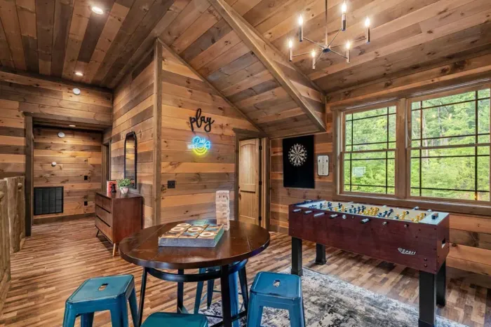 Take the fun upstairs! From darts and foosball to board games and cozy seating, this game room is the perfect hangout spot for laughs and late-night tournaments