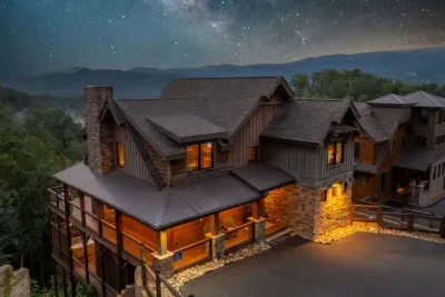 Starry night drone shot of the cabin.