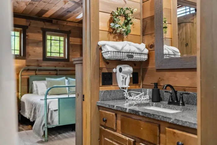 Enjoy a bathroom stocked with starter toiletries, a hairdryer, and luxe touches like gold eye masks, makeup wipes, and shower steamers.