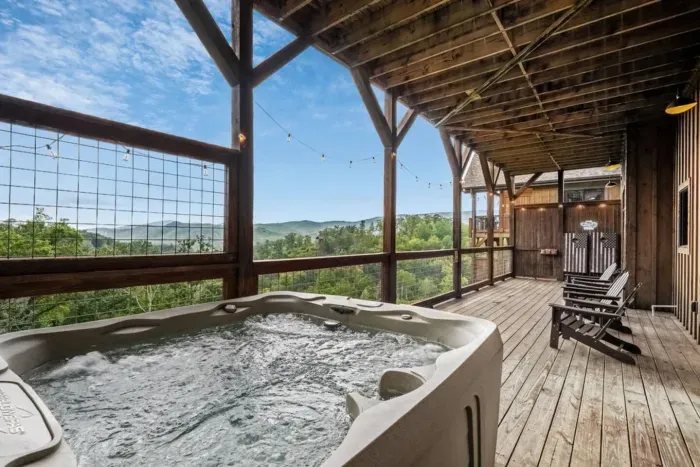 This deck was designed for memories. Lounge in the hot tub, enjoy outdoor seating with views, or light up the night with cozy deck lights. Cornhole and conversation come together in this inviting space.