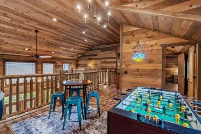 The upstairs game room is designed for all ages to enjoy, from family tournaments to late-night laughs.